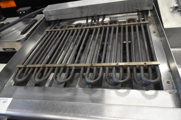 Star Max stainless steel commercial countertop grill with heating elements, in used condition, shown on a kitchen counter.