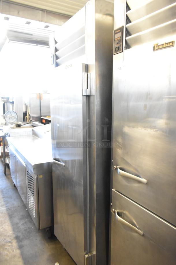 Traulsen AHT132WUT-FHS stainless steel commercial refrigerator, 24.2 cu. ft., one section, 115V, sleek design, used condition.