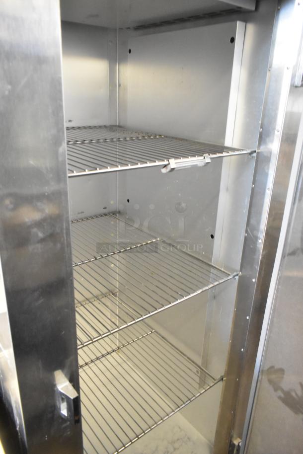 Traulsen AHT132WUT-FHS stainless steel commercial refrigerator, 24.2 cu. ft., one section, four wire shelves, 115V, clean.