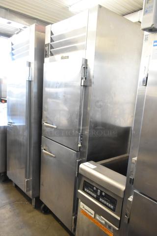 Traulsen RLT132WREHHS stainless steel commercial fridge, 2 half doors, on casters, 115/208-230V, 1 phase, well-maintained.