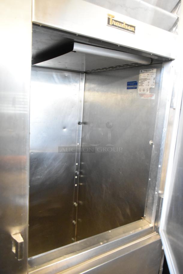 Traulsen RLT132WREHHS stainless steel commercial refrigerator, model with 2 half-size doors, on casters, 115/208-230V, 1 phase.