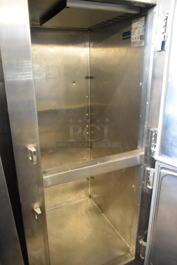 Traulsen RLT132WREHHS stainless steel commercial half-door refrigerator, good condition, interior view.