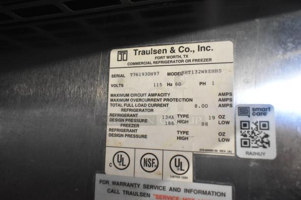 Traulsen RHT132WREHHS stainless steel commercial fridge label showing model, voltage, and refrigeration specs.