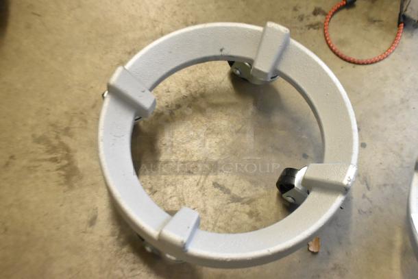 Brand new metal bowl dolly on commercial casters, scratch and dent condition, sturdy build, ideal for transport.