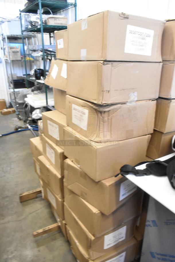 56 brand new boxes of 3030TCDT-7250 3"x3" label rolls stacked in warehouse, each with visible label identifiers.