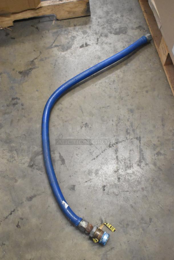 Blue gas hose with metal fittings and yellow tags, in good condition. Auction for 4 hoses total.