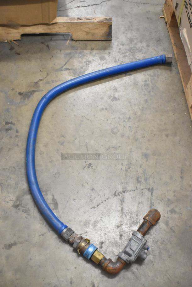 Blue gas hose with metal fittings, showing signs of use; part of a lot of four hoses.