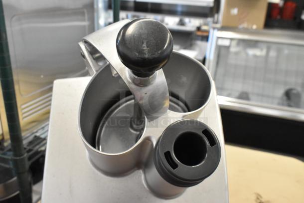 Robot Coupe metal continuous feed head for food processor, features dual feed openings, ergonomic handles, in good condition.