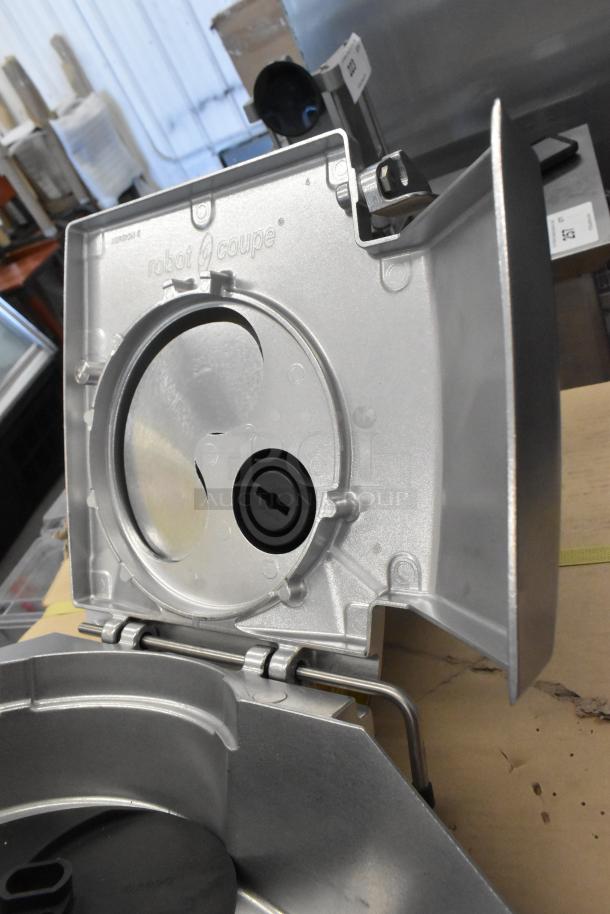 Robot Coupe metal continuous feed head for food processor, featuring a durable silver finish, in excellent condition.