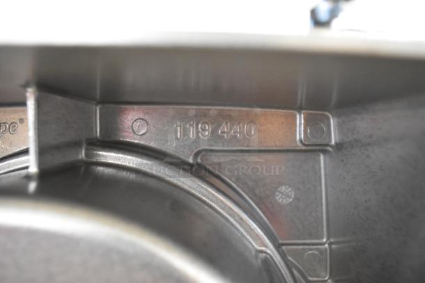 Robot Coupe metal continuous feed head, model 119440, for food processor, showcasing internal metal markings and smooth finish.
