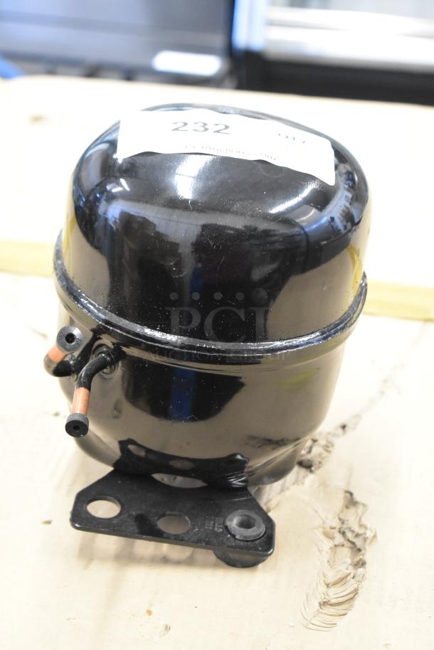Cubigel NUT90LR compressor, 115-127V, 1 phase, black, with visible mounting brackets and numbered label "232".