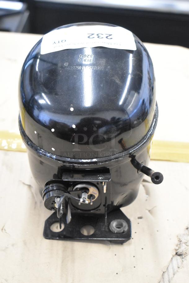 Cubigel NUT90LR compressor, black, 115-127V, 1 phase, visible label with serial number, in good condition.