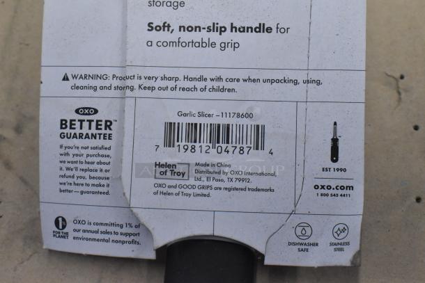 OXO garlic slicer packaging, model 11178600, features soft non-slip handle. Made in China, supports environmental nonprofits.