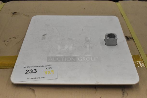 White board with a metal square piece on a cardboard surface. Label reads "For More Great Auctions Visit PCIauctions.com, QTY VX9."