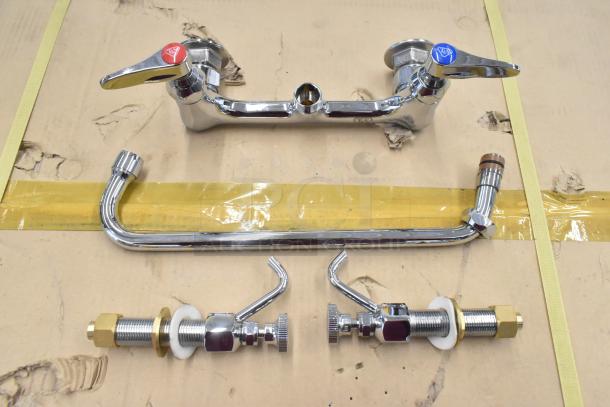 Chrome faucet set with red and blue handles, unassembled. Includes spout and fittings. Appears in good condition.