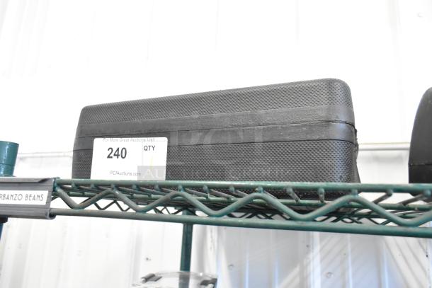 Dymo RhinoPro 5000 label printer in black hard case, auction tag "240" visible.