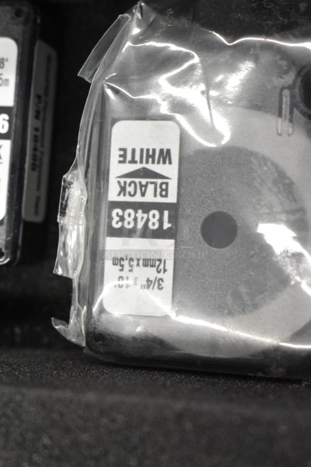 Dymo RhinoPro 5000 label printer in hard case, featuring black on white label cartridge, model 18483.