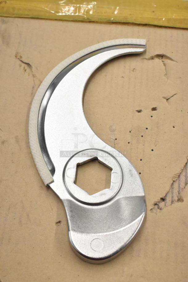 Food processor S blade, stainless steel, hexagonal center, gently used, for efficient slicing and chopping tasks.