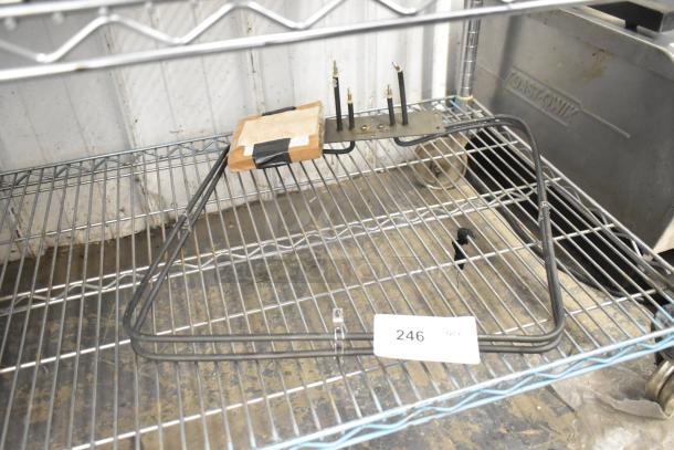 Blodgett 8595 Element Assy on a metal shelf. Coiled metal construction, includes mounting plate. Tag reads "246 QTY". Appears in good condition.