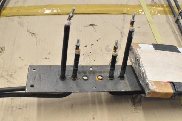 Blodgett 8595 Element Assy, metal base with four terminals, moderate wear, original packaging with labeling visible.