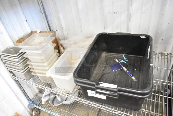 Auction tier lot including black bus bins, stackable transparent drop-in bins on metal shelving, various kitchen items, good condition.
