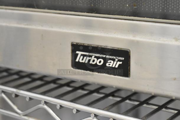 Turbo Air DHHS CODE H7NF stainless steel commercial microwave oven, 120 volts, shown with manufacturer label.