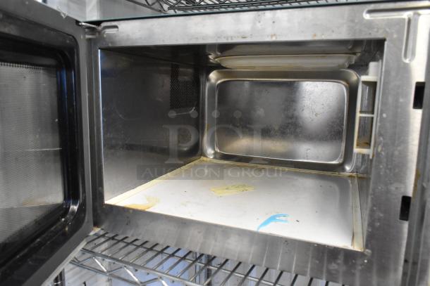 Turbo Air DHHS CODE H7NF stainless steel commercial microwave oven, interior view, showing used condition, 120 volts, 1 phase.