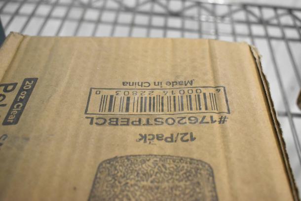 Cardboard box with barcode marked "17620STPEBCL," labeled "20 oz. Clear," indicating Choice pebbled tumbler contents.
