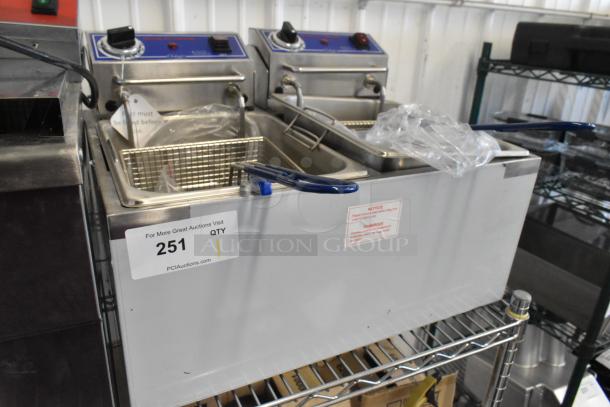Brand new Globe PF32E stainless steel countertop electric fryer, 2 bays, 2 metal fry baskets, 208-240 volts, 1 phase.