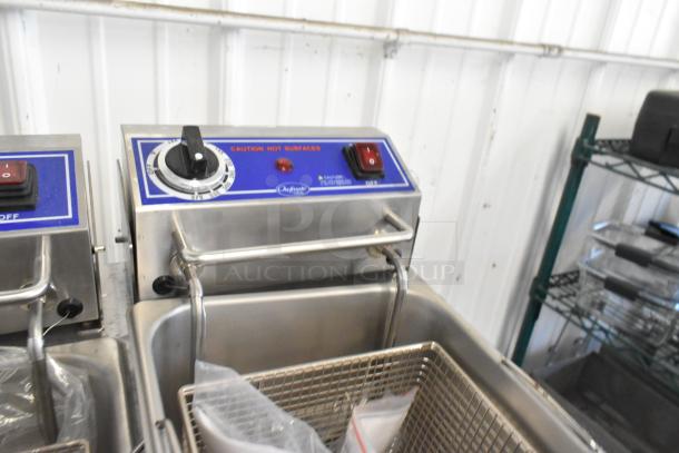 New 2024 Globe PF32E stainless steel countertop 2-bay fryer with 2 fry baskets, 208-240V, 1 phase. Marked "Caution Hot Surfaces."