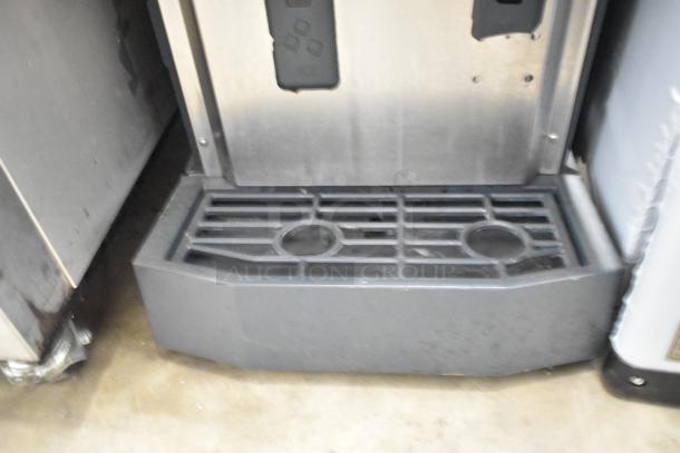 2018 Scotsman HID312A-1A stainless steel commercial nugget ice & water dispenser, showing drip tray and front panel.