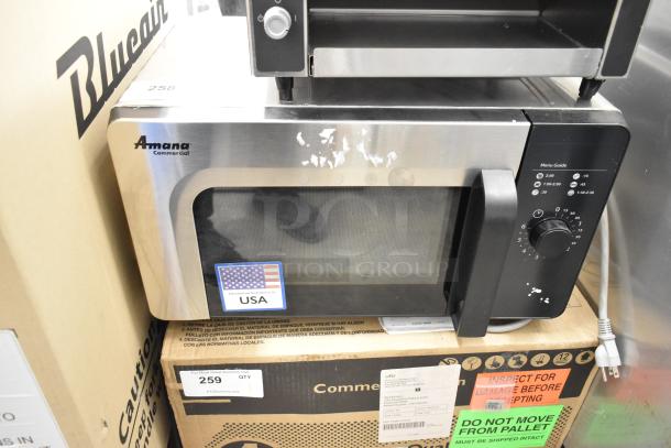 2021 Amana RMS10DSA stainless steel commercial microwave oven, 120V, featuring a manual dial control panel, minor surface wear.