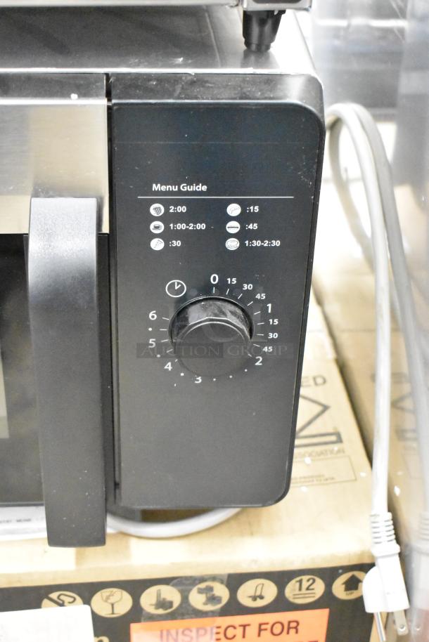 2021 Amana RMS10DSA stainless steel commercial microwave, 120V, 1 phase; dial control; menu guide visible.