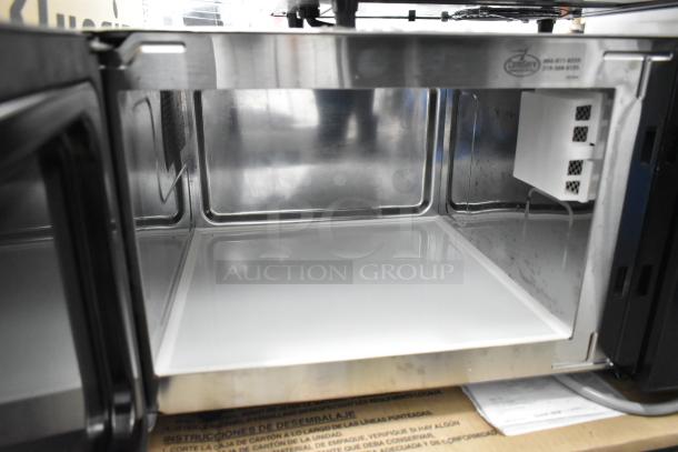 2021 Amana RMS10DSA stainless steel commercial countertop microwave oven, open door, clean interior. 120 volts, 1 phase.