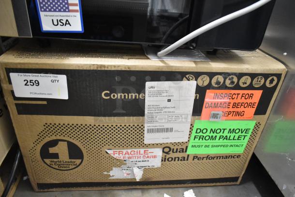 IN ORIGINAL BOX! 2021 Amana RMS10DSA Stainless Steel Commercial Microwave, 120V, tags indicate "Inspect for damage" and "Do not move from pallet."