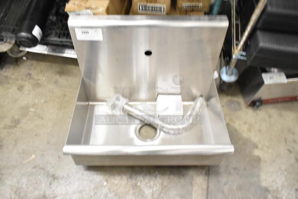 Brand new stainless steel single bay wall mount sink, scratch and dent condition, missing one bracket, includes plumbing.