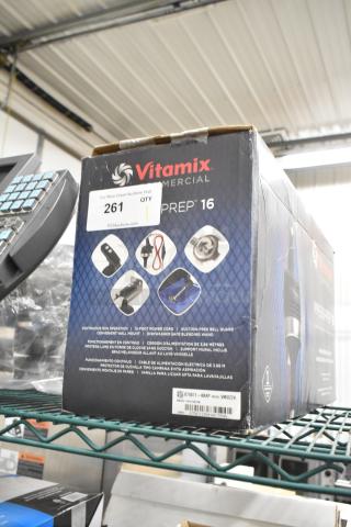 Vita-Mix VM0224 Immersion Blender in original box. Features 12-foot power cord, suction-free bell guard, dishwasher safe. 115 volts, 1 phase. Box shows usage instructions and product details.