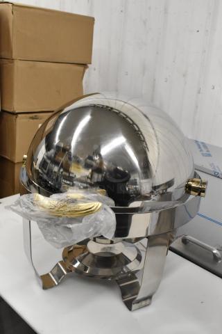 Brand new stainless steel round roll-top chafer, countertop model, with minor scratches, includes plastic-wrapped handles.