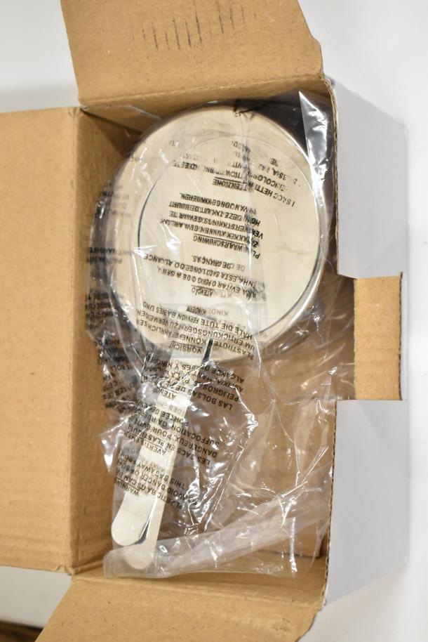 Brand new stainless steel round roll top chafer in protective packaging, in original box. Scratch and dent condition.