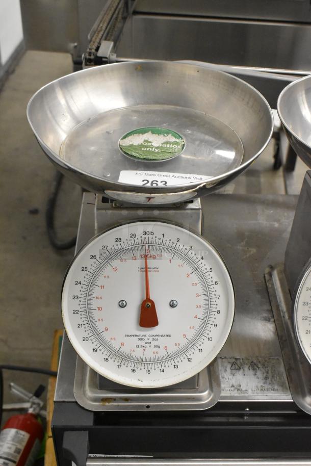 Two Yamato SM(N) metal countertop food portioning scales, features include a 30lb capacity, temperature compensation, and visible markings.