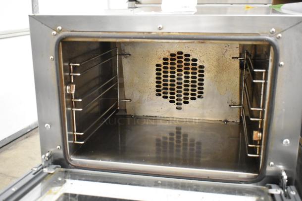 2021 Cadco Unox XAF003 Roberta convection oven, metal, countertop, electric, 120V, visible interior and fan, gently used.