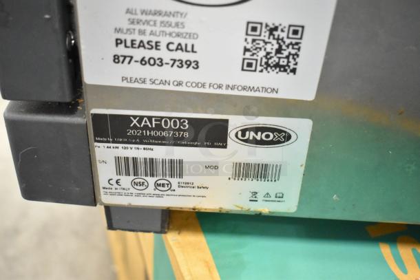 2021 Cadco Unox XAF003 Roberta convection oven label, showing model, 120V, 1 phase, NSF, MET certifications. Made in Italy.