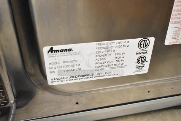 Alt text: 2021 Amana RCS10TS stainless steel microwave label, showing model, power, and certification details.