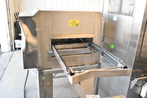 2017 Belshaw Adamatic TG50 stainless steel thermoglazing station on casters, 208V, 1 phase, with caution label visible.