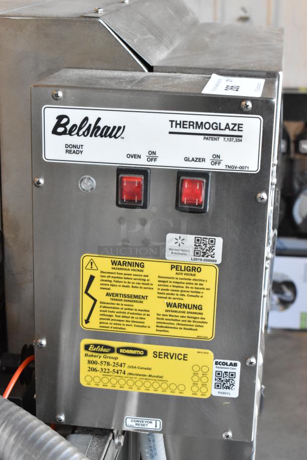 2017 Belshaw Adamatic TG50 Thermoglazing Station, stainless steel, on commercial casters. Labels with controls and safety warnings visible.