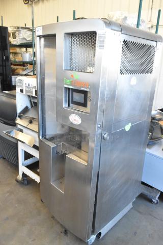JBT Fresh N Squeeze 2ND-GEN-MFJ commercial citrus juicer, stainless steel, on casters. 120V, 1 Phase. Visible branding.