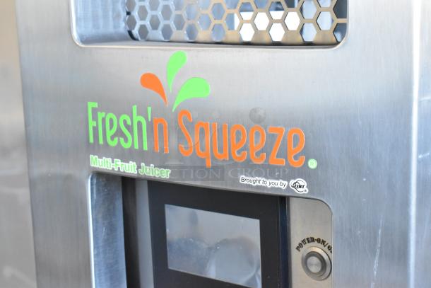 JBT Fresh N Squeeze 2ND-GEN-MFJ citrus juicer, stainless steel, commercial floor style, branding visible.