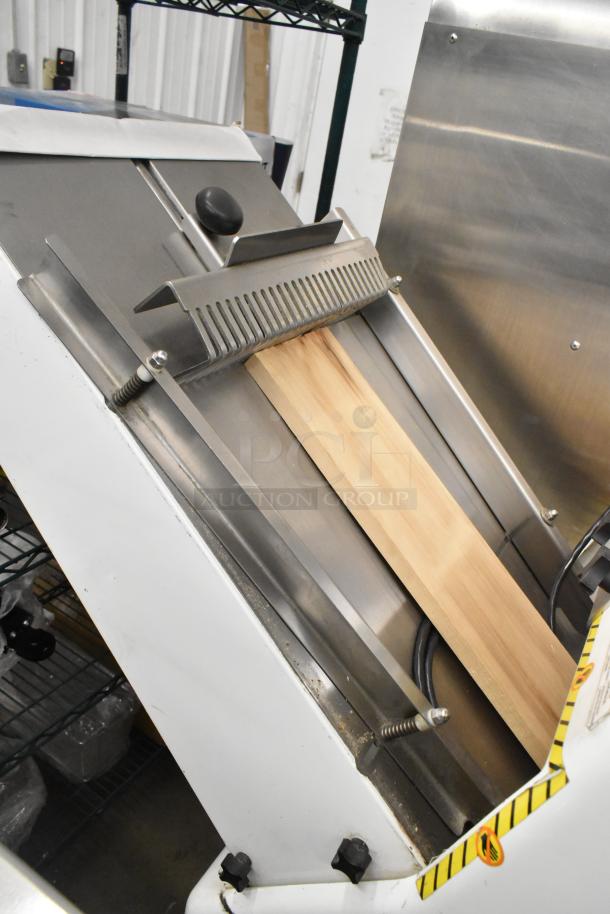 Oliver 797-32NC metal bread loaf slicer on commercial casters, 115 volts, 1 phase, in good condition.