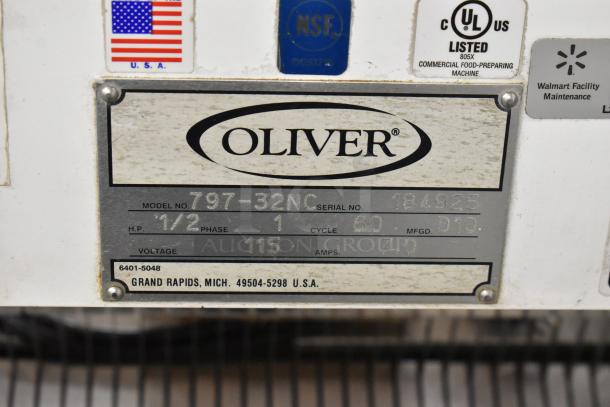 Oliver 797-32NC commercial bread loaf slicer, metal floor style, 115V, on casters, model label with specifications shown.