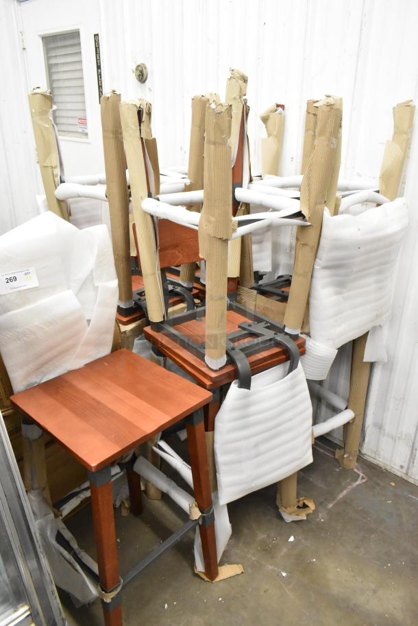 9 Lancaster Table & Seating bar stools with rustic mahogany finish. New scratch and dent condition. Industrial backless design.
